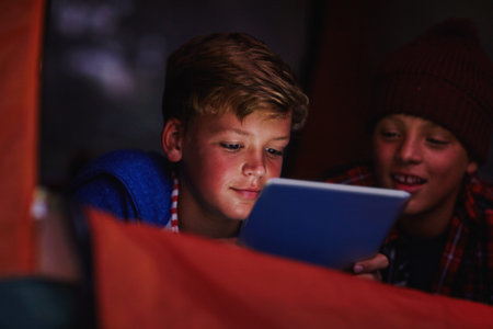 Night, children and tablet in fort with ebook for reading, adventure story and bonding together....