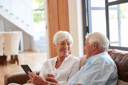 Streaming, happy or old couple in house with tablet, scroll or search for digital entertainment in...