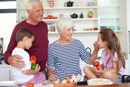 Cooking, happy and grandparents with children in kitchen for learning, thanksgiving holiday reunion...