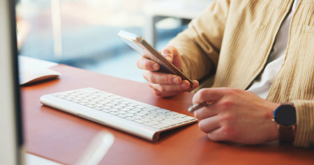 Hands, typing or man in office with phone, networking or schedule change for meeting Digital,...