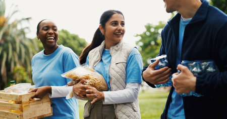Food, volunteer and team with woman in park for donation, community service or ngo project....