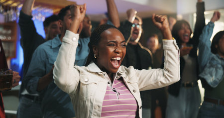 Victory, watching and people in house with fist pump, goal or celebration in soccer tournament. Support, sport and football fans in home with game success, score lead or excitement in viewing partyの写真素材