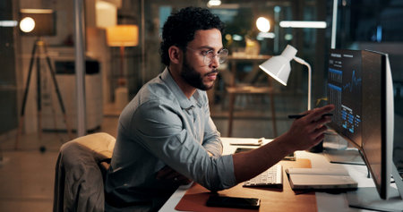 Computer, trading and business man reading with stock market info, finance data and night. Trader,...