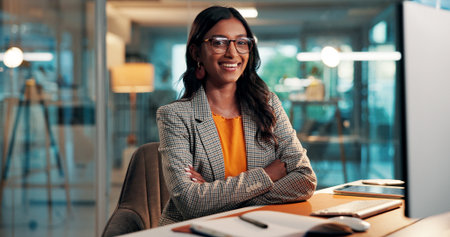 Crossed arms, happy and portrait of businesswoman in office with confidence for finance career. Professional, glasses and female financial manager with pride for accounting internship in workplace.の写真素材