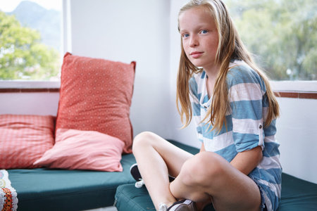 Calm, portrait and relax with girl child in bedroom of home for break, development or growth....