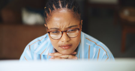 Business, thinking and black woman with tech, wonder or planning for creative project. African person, contemplation or freelancer with pc, decision or confused with deadline for submission or ponderの写真素材