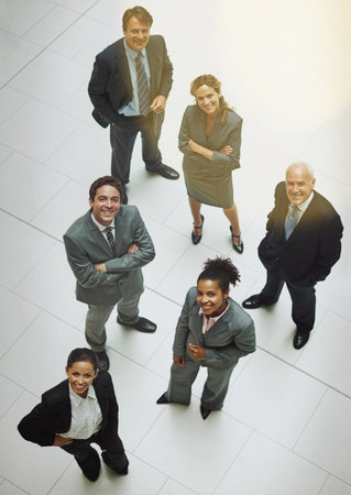 Above, portrait and business people in office, smile with teamwork. Group, happy employees and men with women, cooperation with confidence and lawyers with successの写真素材