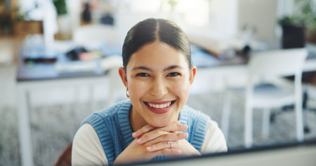 Creative, portrait and woman with computer, office and research for article on website or journalism. Confident, reporter and person with technology for project, happiness and newsroom in Canadaの写真素材
