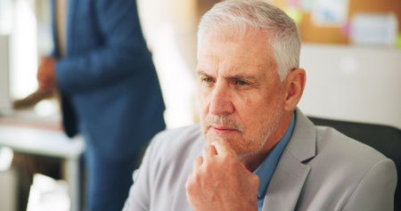 CEO, planning and man in office, ambitious or vision for investment opportunity, thinking or serious. Corporate, investor and mature person with ideas for business growth, coworking and reflectionの写真素材