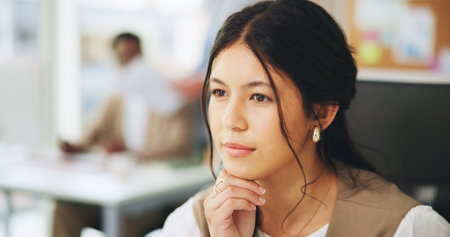 Thinking, marketing or woman in office with review, brainstorming or insight for company growth. Reflection, thoughts or clerk in agency with idea, inspiration or problem solving for brand promotion.の写真素材