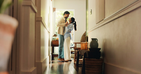 Smile, couple and dancing with love at house for romance, affection and bonding together with rhythm. People, holding hands and movement for weekend fun, romantic partner and embrace for commitmentの写真素材