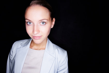 Happy, mockup space and portrait of business woman in studio for corporate career development. About us, agency and recruitment with confident employee on black background for professional prideの写真素材