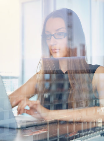 City reflection, businesswoman or laptop in hotel room, review proposal or financial project management. Tech, reading or advisor by window for investment planning, market research or assets strategyの写真素材