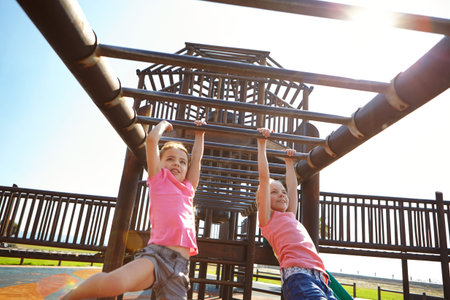 Playground, happy and children outdoor on bars for playing games, having fun and learning in park....