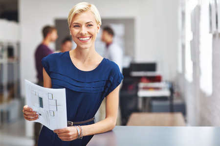 Happy, woman and thinking in office with document for floor plan, interior design and creative idea. Designer, person and reflection with layout paperwork, renovation blueprint or remodeling project.の写真素材