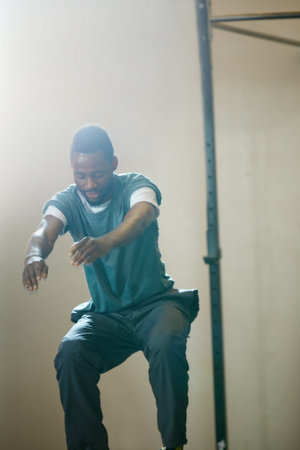 Fitness, squat and black man in gym for training, workout and exercise for wellness. Personal...
