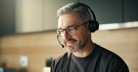 Remote work, headset and man in home for telemarketing, outbound call and lead generation for sales...