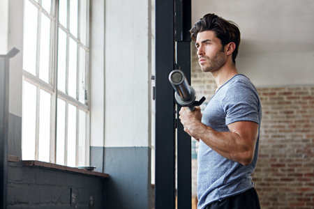 Fitness, weight training or man in gym with curl bar, power or bicep routine in bodybuilding....