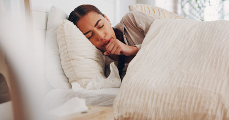 Illness, fever and woman with cough in bed from flu recovery, viral infection and lung disease....