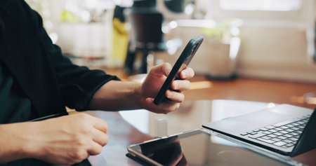 Phone, hands and man barber in salon with communication for appointment schedule with client. Cellphone, computer and hairdresser with contact, email or connectivity on mobile app at beauty parlor.の写真素材