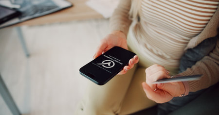 Hands, phone screen and credit card in home for online shopping, check icon and easy payment in lounge. Person, smartphone and digital banking for ecommerce, above or fintech app with symbol at houseの写真素材