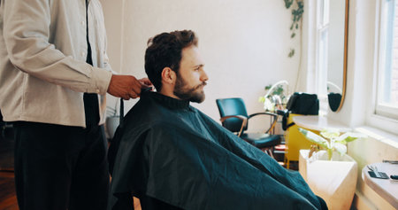 Man, hairdresser and preparation with haircut for grooming, beauty or style in barbershop. Male person, client or customer getting ready with barber for hairstyle, fresh cut or new look in salonの写真素材