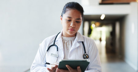 Tablet, doctor and woman in clinic for research, healthcare or reading report with information....