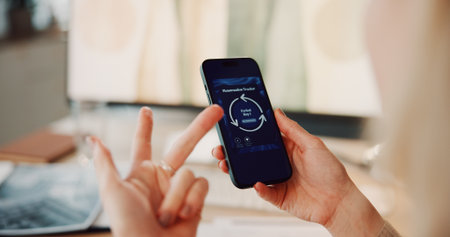 Hands, menstrual cycle and phone screen with woman in home for counting days or period tracking. Fingers, gynecology app and schedule with person in apartment for health, menstruation or wellnessの写真素材