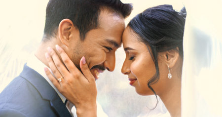 Smile, couple and love with romance at wedding ceremony, celebration and relationship commitment. Happy, people and bride with groom affection, marriage and bonding with connection at special eventの写真素材