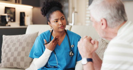 Breathing, medical or neck with nurse and old man on sofa in living room of home for checkup. Appointment, healthcare or throat with caregiver and senior patient in apartment for insurance or supportの写真素材