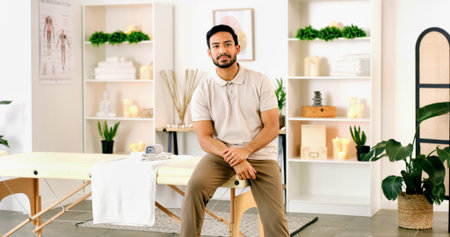 Portrait, man and physiotherapist in office for health, wellness or about us for medical service. Confidence, person and physical therapist in clinic for healing, expert chiropractor and professionalの写真素材