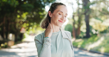 Woman, fitness and neck pain with stress in nature for workout accident, strain or pressure. Active, female person or sore shoulder with ache or injury for muscle tension, fibromyalgia or sprainの写真素材