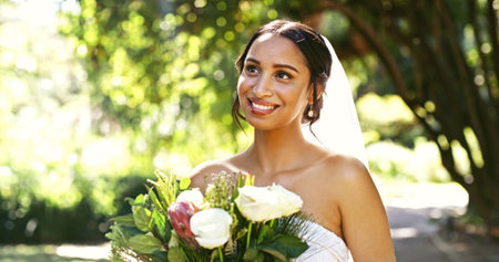 Flowers, bride thinking and woman at park for love, idea and wedding celebration at special event....