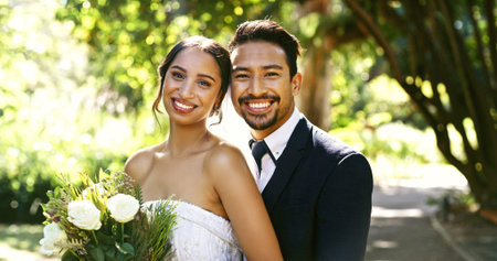 Wedding, couple and portrait with flowers at park for marriage ceremony, union and love commitment....
