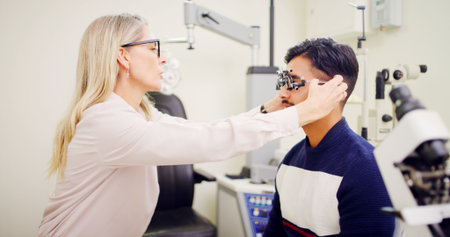 Optometrist, client or trial lens frame for eye exam, vision assessment or consultation for clear sight. Patient test, optometry or people with tool to determine prescription, iris health or clinicの写真素材