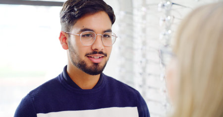 Optometry, glasses and man with consultation, help and talking with clear vision, feedback or...