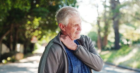Senior man, neck pain and fitness with injury, stress or muscle tension for emergency or strain. Active, elderly or male person with sore shoulder or ache for joint inflammation or fibromyalgiaの写真素材