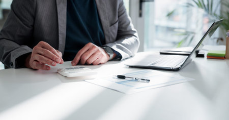 Businessman, hands or accounting with calculator for finance, project budget or expenses in office....