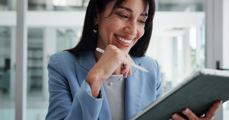 Reading, smile or business woman with tablet in office, planning or check report for fund management. Review portfolio performance, happy or wealth manager monitor assets, track trade market or techの写真素材