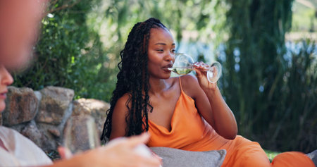 Alcohol, relax and thinking with woman outdoor at wine farm for getaway or tasting experience. Break, drink and glass with person at agricultural venue for growth, social gathering or sustainabilityの写真素材