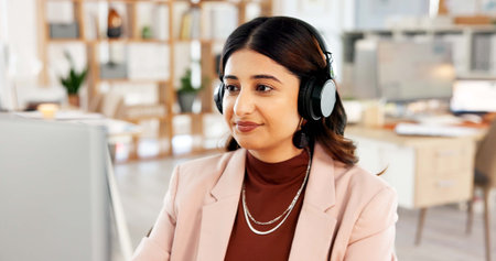 Headphones, computer and businesswoman in office with music, playlist or radio for creative project....