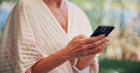 Hands, cellphone and woman with internet, outdoor and connection with social media. Mature person,...