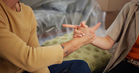 Couple, handshake and moving in with boxes in new home for bonding, connection and celebration in...
