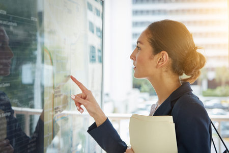 Businesswoman, reading and pointing with bus timetable, schedule arrival and commute for work....