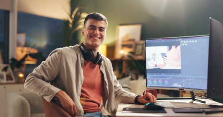 Happy man, portrait and night with video editor on computer for digital marketing in office. Male people, creative or designer working late with smile on technology for UI development or app designの写真素材
