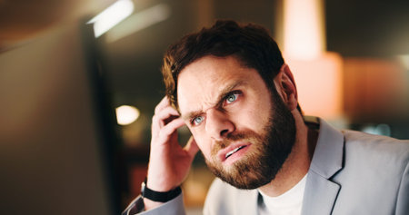 Confused, night or businessman in office with computer for system glitch, technical crisis or report...