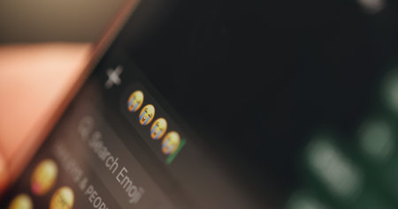 Person, hands and phone with screen for emoji, message and text app for connection and networking....
