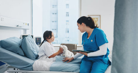 Tablet, nurse and child in bed with teddy bear for healthcare checkup, recovery and wellness. Sick...