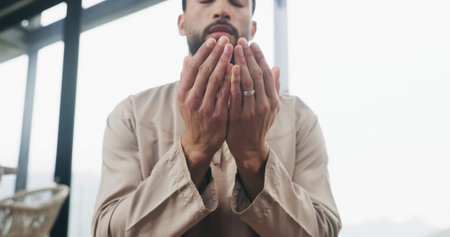 Hands, home and muslim man with prayer for religion, faith and dua on Ramadan Kareem. Islam, praying...