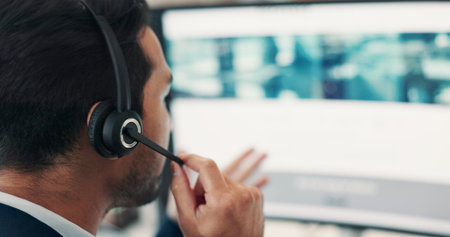 Man, talk and headset with computer screen in call centre for customer service, online query and...